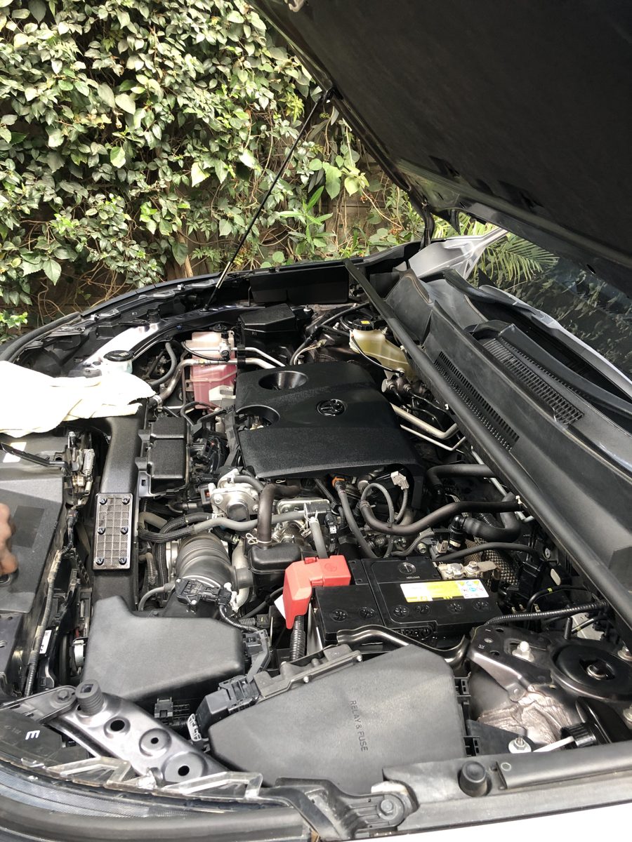 The same engine bay clean and dressed after steam cleaning